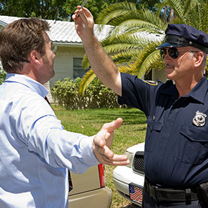 Police officer conducting field sobriety test on driver in Los Angeles under legal scrutiny.