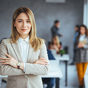 A confident woman with crossed arms,. California Domestic Violence Court Preparation