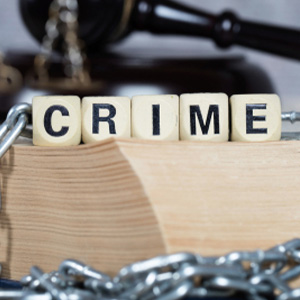 Gavel and CRIME blocks in chains for California wobbler law concepts.